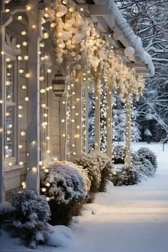 a house covered in snow with christmas lights