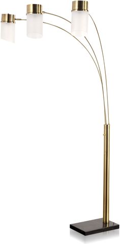 the three light floor lamp is brass and has white glass shades on each side, along with a black base