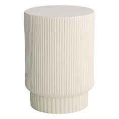 a white vase sitting on top of a table