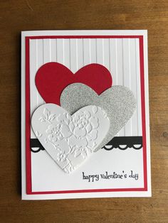 a valentine's day card with two hearts on the front and one in the back