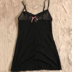 Sheer Black Nightie With Pink Bow. Adjustable Straps, Size Small. Brand New Without Tags Black Tops For Summer Sleepover, Black Sleeveless Sleepwear For Sleepovers, Black Sheer Y2k Top, Black Sheer Y2k Style Tops, Black Sleepwear For Sleepovers, Black Sheer Top In Y2k Style, Black Sheer Top Y2k Style, Black Coquette Sleepwear For Sleepover, Fitted Black Top For Sleep