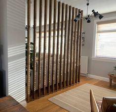 a living room with wooden slats on the wall