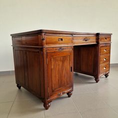 an old wooden desk with two drawers