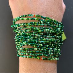 Beautiful Multi-Strand World Of Good Beaded Bracelet. Predominately Shades Of Green, With A Few Tiny Pops Of Other Colors. The Beads Are Glass, And The Bracelet Is Handcrafted In Guatemala. Approximate Measurements Body Of Bracelet: 5 Inches Full Length End To End: 7.5 Inches Green Beaded Wrap Bracelet For Festival, Green Wrap Bracelet With Colorful Beads, Green Bead Bracelet For Festivals, Green Bracelets With Colorful Beads For Festival, Festival Green Bracelets With Colorful Beads, Green Colorful Beads Festival Bracelet, Green Beaded Friendship Bracelets For Festivals, Green Wrap Bracelet With Round Beads For Festival, Green Wrap Bracelet With Round Beads For Beach