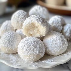 powdered sugar balls on a white plate