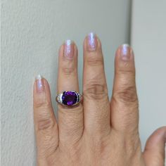 Beautiful 3.61 ct. amethyst oval and 0.41 ct. good quality white diamond rounds.  Handmade in platinum.  Ring size 7.  Metal:Platinum Stone: Amethyst,White Diamond Stone Cut: Oval Cut  Dimensions reference the ring size and are not specific to the ring itself. Exact ring dimensions are not provided. Please reach in the seller Q&A for questions. Formal Purple Cubic Zirconia Diamond Ring, Oval Amethyst Ring With Prong Setting In Cubic Zirconia, Oval Amethyst Ring With Cubic Zirconia In Prong Setting, Purple Oval Diamond Ring, Oval Amethyst Ring With Cubic Zirconia Accent Stones, Purple Cushion Cut Brilliant Ring, Purple Amethyst Oval Diamond Ring, Purple Brilliant Cushion Cut Rings, Oval Diamond Amethyst Ring In Fine Jewelry Style