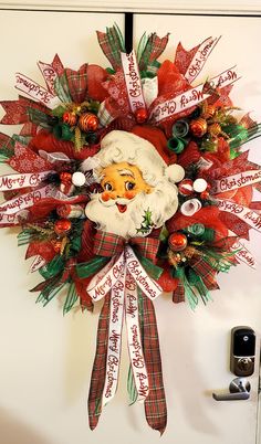 a christmas wreath with santa claus on it