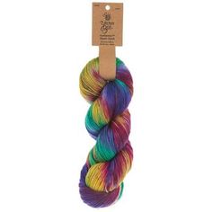 a skein of multicolored yarn with a brown tag on it's side