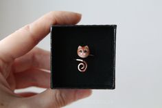 Adjustable Cat Ring Totem Ring Kitten Tiger Jewelry Open Ring Feline Ring Polymer Clay Ring Animal Lover Jewelry Cute Cat-like Ring Material: Polymer clay, copper. Shape: Animal Adjustable (size may regulate between 6-9 USA) The cat size is about 1x1cm Base of the ring is copper wire. The cat made of polymer clay. Your ring will arrive attractively packaged in a paper gift box that is perfect for gifting or for keeps. The real color may differ slightly from those that you see on your display. To extend the life of your jewelry please wear it carefully, take it off before going to sleep and do not wash with abrasive materials. ✿ ✿ ✿ See other jewelry in my shop ✿ ✿ ✿ https://stormvlas.etsy.com Cat Design Jewelry Ring As A Gift, Adjustable Cat Design Ring As Gift, Ring Polymer Clay, Tiger Jewelry, Clay Ring, Polymer Clay Ring, Wire Cover, Acrylic Varnish, Lover Jewelry