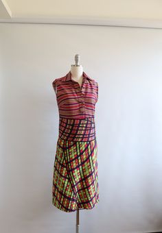 A wonderful, bright and cheery Roberta Di Camerino dress. Cool print, reminds me of a stained glass window.  Marked size 44, fits like a small. Please compare measurements below to something that already fits you.  Measured on the front, laying flat: Length 40"  Bust 17" Waist 15" Hips  16.5" In very good vintage condition. Arm holes are un-hemmed.  Local pickup available in downtown Toronto. Sleeveless Summer Dress, Downtown Toronto, Sleeveless Dress Summer, Stained Glass Window, Glass Window, Summer Dress, Pink And Green, Stained Glass, Favorite Outfit