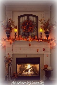 a fireplace decorated with fall leaves and candles