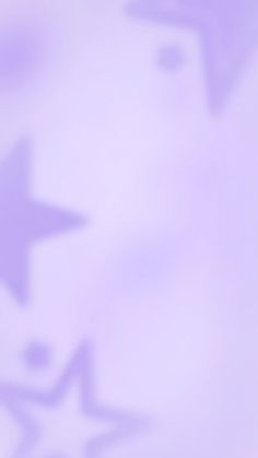 a blurry image of stars on a purple and white background with the word star written below it