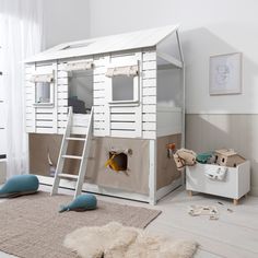 a child's bedroom with a bunk bed and play house