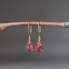 "Stunning faceted Hot Pink Quartz teardrops are wire wrapped with 14k gold filled wire on to 14k gold vermeil long earwires.  Wonderful lightweight statement earrings to wear anytime in the most beautiful bright color!   Pink Quartz teardrops: 10x13mm Total length of earrings: 1 1/2\" As the owner, maker, designer, and curator of this shop, I take great pride in providing you with jewelry that you will love to wear everyday, for special occasions, and for many years to come.  Please read my Shop Faceted Briolette Teardrop Earrings, Teardrop French Hook Earrings As Gift, Gift Briolette Crystal Earrings, Briolette Crystal Earrings With Ear Wire For Gift, Briolette Crystal Earrings For Gifts, Gift Crystal Briolette Earrings With Ear Wire, Pink Faceted Drop Earrings, Gift Teardrop Crystal Earrings With French Hook, Pink Drop Earrings With Ear Wire