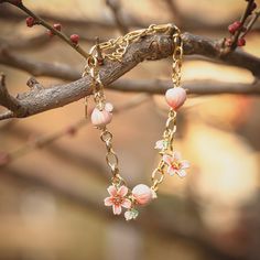 If you like peach flowers, you can’t miss Peach Blossom Bracelet from Selenichast jewelry store. This sweet and fancy bracelet is well made with enamel paint. And if you need a high quality bracelet, it’s the right one! ﻿Both classic and elegant, this bracelet features lustrous peaches held on a delicate cable chain, offering you a fragrant and sprightly visit in the midst of peach blooms. This natural-inspired accessory is here to hold down your wardrobe. Details Plating: 18K Gold Materials: 18 Peach Bracelet, Fancy Bracelet, Peach Jewelry, Blossom Bracelet, 18k Gold Bracelet, Chinese Jewelry, Simple Gift Wrapping, Peach Blossom, Peach Flowers