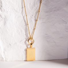 A perfect mix of modern beauty and fun, this personalized initial matrix pendant will get plenty of second looks. Available in gold, rose gold or silver, just pick the color that matches your mood. Engrave this stunning pendant with the initial of your family, littles, or besties! Be fabulous day or night with this stunning necklace. Give as a gift or treat yourself. Available in 14k gold plated, rhodium plated or 14k rose gold plated brass Pendant size: 3/4" by 1/2" 20" or 30" satellite chain o Luxury Initial Pendant Necklace For Gift, Luxury Personalized Sterling Silver Charm Necklace, Luxury Initial Pendant Name Necklace As Gift, Minimalist Name Necklace With Initial Pendant And Charms, Luxury Personalized Initial Pendant Necklace, Minimalist Name Necklace With Initial Pendant, Tarnish Resistant White Gold Initial Pendant Necklace, Luxury Rose Gold Initial Pendant Necklace, Modern Everyday Charm Necklaces With Initial Pendant