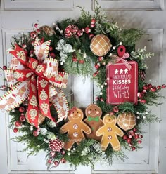 a wreath with gingerbreads and christmas decorations