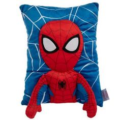 a spiderman pillow sitting on top of a blue pillow