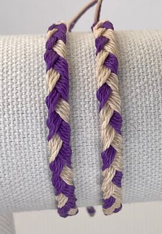 Hand woven bracelets in your favorite team colors! Sea, sun, snow, sweat and shower safe. Adjustable, one size fits most. Guys wear 'em, too Adjustable Purple Braided Bracelets For The Beach, Purple Sliding Knot Bracelet For The Beach, Purple Bracelet With Sliding Knot For Beach, White Braided Adjustable Beaded Bracelets, Casual Purple Braided Bracelets For Beach, White Braided Bracelet For Friendship, White Braided Friendship Bracelet, Woven Bracelets, Braided Bracelets