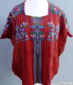 Vintage Guatemalan unique handmade weaved Red cotton Santo Domingo Xenacoj huipíl. Huipil in good condition. You will receive ready to wear as a blouse. Let us know any adjustment needed. W29" x H21" Check our complete list of available huipils: https://mayanft.com/shop/gallery/santiago-atitlan https://mayanft.com/shop/gallery Hand wash with cold water carefully. One photo and tracking code will send when be shipped. Wanna check other huipils from Xenacoj? https://t.ly/ORPje -------------------- Traditional Red Beach Blouse, Traditional Red Blouse For Beach, Bohemian Red Blouse With Traditional Patterns, Red Bohemian Blouse With Traditional Patterns, Red Folk Style Blouse For Beach, Red Folk Blouse For Festivals, Folk Style Red Blouse For Festivals, Folk Style Red Blouse For The Beach, Red Folk Style Blouse For The Beach