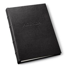 a black book with the word agenda written on it's front and back cover