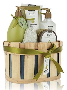 a wooden basket filled with lots of different types of soaps and hand lotions