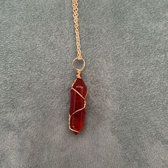 New Beautiful Red Crystal In Gold Wire Cage With 20 Inch Gold Adjustable Chain. Red Spiritual Metal Jewelry, Spiritual Red Metal Necklace, Red Spiritual Pendant Crystal Necklaces, Red Spiritual Crystal Pendant Necklace, Spiritual Red Crystal Pendant Necklace, Red Wire Wrapped Pendant Necklace, Red Hand Wrapped Necklace As Gift, Red Hand Wrapped Jewelry Gift, Red Hand Wrapped Necklace For Gift