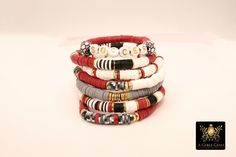 Red, Gray, White and Black Bracelets in Heishi Beads by Regina Harp Designs These bracelets are in a red, white, black, gray and gold colors with heishi beads and drum beads with your choice of bracelet style. They can be made with our other bead colors as well; message us if you would like to customize your bracelet.  If you need a smaller or extra large size in the bracelet, please leave us a note with your order.   To measure your wrist size you can wrap a piece of string around your wrist and mark it.  Then lay the string down flat and measure how long it is and that is your bracelet size. **SPECIFICATIONS** Measurements Approximately: Length is 6.5~7 inches  Stones: 6 mm Heishi clay beads Quantity of Items: 1 bracelet unless otherwise selected Materials: Fiber stretchy cord, Brushed g Red Stacked Beaded Bracelets For Gifts, Red Stacked Beaded Bracelets As Gift, Red Adjustable Stacked Bracelets, Adjustable Stacked Red Bracelets, Adjustable Red Stacked Beaded Bracelets, Adjustable Stacked Red Beaded Bracelets, Red Stackable Bracelets With Round Beads, White Jewelry Box, Clay Bead