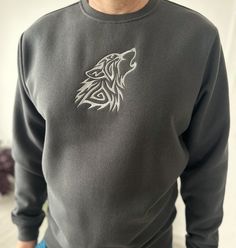 Silver Wolf Embroidery decorates a sturdy and warm sweatshirt bound to keep you warm in the colder months. The sweatshirt is soft and quality, 80% cotton and 20% polyester. You feel comfortable and inspired wearing this product. Enjoy! Please, check the size chart before you place your order. Fleece Hoodie Sweatshirt With Embroidered Graphics, Embroidered Fleece Hoodie Sweatshirt, Winter Gray Sweatshirt With Embroidered Logo, Gray Embroidered Logo Sweatshirt For Winter, Gray Hoodie Sweatshirt With Embroidered Logo, Fleece Crew Hoodie With Embroidered Graphics, Custom Embroidered Winter Hoodie, Gray Crew Neck Hoodie With Embroidered Logo, Gray Embroidered Logo Hoodie Sweatshirt