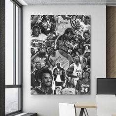 a black and white photo of the los angeles lakers basketball team on a wall above a desk