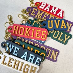 several key chains with different colored letters on them