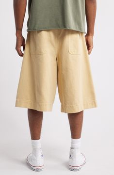 Relaxed and very roomy, these shorts cut from soft cotton twill hit well below the knee and slouch like they're your most comfortable old favorites. Exclusive retailer 13 1/2" inseam; 32" leg opening; 15" front rise; 19" back rise (size 32) Zip fly with button closure Front slant pockets; back patch pockets 100% cotton Machine wash, tumble dry Imported Spring Cargo Shorts With Elastic Waistband And Relaxed Fit, Spring Knee-length Cargo Shorts, Baggy Cotton Cargo Shorts For Summer, Cotton Shorts With Pockets For Spring, Cotton Short Pants For Spring, Spring Cotton Short Pants, Spring Short Cotton Pants, Spring Cargo Shorts With Relaxed Fit, Casual Bermuda Cargo Shorts For Spring