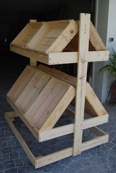 three wooden boxes stacked on top of each other