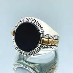 Stone: The centerpiece of this ring is a stunning oval-cut black onyx stone. Black onyx is not only visually striking but also symbolizes strength and protection. Its deep black hue adds a touch of mystery and elegance to your look. Handmade: Each ring is meticulously handcrafted by skilled artisans, ensuring a unique and one-of-a-kind piece of jewelry. Our commitment to quality craftsmanship means you'll receive a ring that's made with attention to detail and passion. Versatile Style: This ring boasts a classic design that can effortlessly complement a variety of outfits and occasions. Whether you're attending a formal event or dressing casually, it's a versatile accessory that elevates your style. Thoughtful Gift: This ring makes for an exceptional gift choice. Whether you're surprising Luxury Black Oval Signet Ring, Luxury Black Oval Rings, Luxury Black Engraved Ring In Sterling Silver, Oval Black Enamel Ring, Black Sterling Silver Signet Ring, Black Oval Engraved Sterling Silver Ring, Oval Black Sterling Silver Engraved Ring, Luxury Black Signet Ring Stamped 925, Black Gemstone Signet Ring