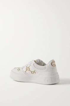 Modern White Sneakers With Embroidered Logo, Luxury Low-top Sneakers With Metallic Logo, Luxury Sneakers With Embossed Logo For Streetwear, Luxury Low-top Sneakers With Logo, White Gucci Sneakers With Logo, Luxury Leather Sneakers With Metallic Logo, Gucci Leather Sneakers With Logo, Luxury White Custom Sneakers With Embossed Logo, Luxury Custom White Sneakers With Embossed Logo