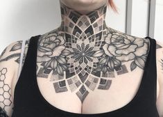 a woman with tattoos on her neck and chest