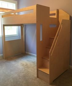 there is a bunk bed with stairs in the room