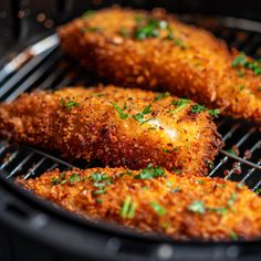 some fried food is cooking on a grill with parmesan cheese and seasoning