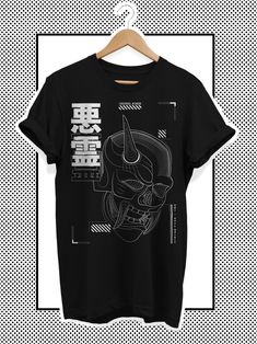 Unisex techwear graphic t-shirt with Japanese style elements, designed for fans of Japanese cyberpunk techwear clothing as well as Harajuku gothic shirts. The product is available in black and white. The t-shirt features an illustrated graphic on the chest. It is made from 100% cotton, and is pre-shrunk. This unique design has been painstakingly illustrated and printed on the t-shirt. The motif shows a futuristic cyberpunk skull motif in an Oni mask. The motif is very futuristic inspired. Due to Edgy T Shirt Design, Cyberpunk Shirt Design, Tech Tshirt Design, Cyberpunk Tshirt Design, Cyberpunk Tshirt, Cyberpunk Shirt, Techwear Shirt, Oni Maske, Cyberpunk Techwear