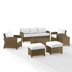 an outdoor furniture set with white cushions