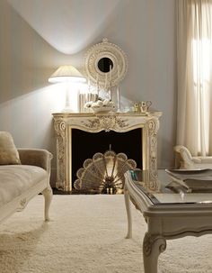 a living room filled with furniture and a fire place in front of a mirror on the wall