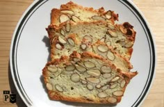 three slices of bread on a plate with almonds