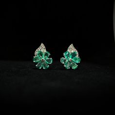 Unveil the epitome of sophistication and grace with our remarkable Emerald Flower Earrings. Exquisitely crafted from the finest 92.5% purity sterling silver, these earrings are a celebration of refined design and masterful artisanship. With their delicately sophisticated design, they are destined to captivate hearts and elevate your style to new heights. A Flourish of Nature's Finest: At the heart of these earrings lies a mesmerizing floral motif, each petal painstakingly faceted with natural em Green Fine Jewelry Cluster Earrings For Formal Events, Fine Jewelry Bridal Earrings With Flower Shape, Formal Bridal Flower Shaped Fine Earrings, Formal Bridal Flower Shaped Earrings, Elegant Gemstone Flower Earrings For Formal Occasions, Formal Flower-shaped Earrings With Prong Setting, Formal Flower Earrings With Prong Setting, Elegant Green Cluster Earrings For Formal Occasions, Elegant Green Cluster Earrings With Prong Setting