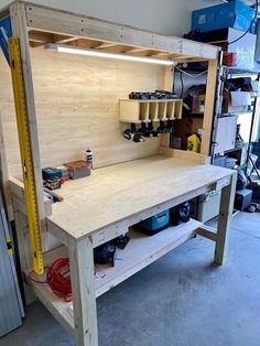 a workbench is built into the side of a garage with tools on it