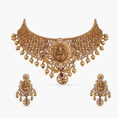 Neelam Antique Choker Set Elegant Gold Kundan Necklace Made Of Brass, Elegant Gold Kundan Necklace In Brass, Elegant Chandbali Bridal Necklace In Brass, Elegant Brass Temple Necklace For Festive Occasions, Traditional Gold Kundan Necklace With Elegant Design, Ceremonial Gold Kundan Necklace, Traditional Brass Jewelry With Elegant Design, Elegant Heavy Brass Temple Necklace, Elegant Brass Jewelry Sets For Festivals