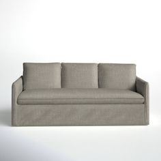 a gray couch sitting on top of a white floor