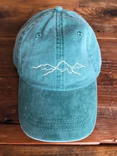 This listing is for one Mountain hat(shown in forest). See pictures for available colors. All hats are stitched with white thread unless specified otherwise. Hats are one size, but are adjustable. Please feel free to convo us with any questions, we would love to help or customize your order. __________________________SHIPPING INFO:Our items are made to order. Please allow 2-3 weeks for shipment depending on what items we have in stock. If you need something asap, please send us a message and we Adjustable Wide Brim Hiking Hat, Adjustable Wide Brim Hat For Hiking, Casual Sun Cap For Outdoor Activities, Adjustable Curved Brim Bucket Hat For Hiking, Adjustable Winter Baseball Cap For Outdoor, Adjustable Short Brim Hat For Outdoor, Curved Brim Hat For Outdoor Activities, Adjustable Hat With Short Brim For Outdoor Activities, Brimmed Hats For Summer Hiking