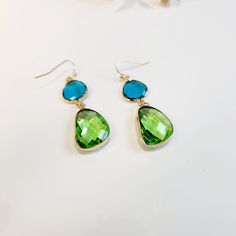 Step into summer with these pretty Blue and Green Olivestone Dangle Drop Pendant Earrings! Perfect for adding a touch of glam to any outfit, these earrings are designed to be both stylish and different, ensuring you stand out with their unique, colourful charm. Visit the Jazzi J shop for more items - https://jazzijbykaren.etsy.com Key Features: * Pretty Design: The beautiful combination of blue and green olivestones creates a captivating look that is perfect for any occasion. * Glamorous Appeal: Green Teardrop Jewelry For Summer, Trendy Blue Dangle Teardrop Earrings, Elegant Turquoise Earrings For Summer, Trendy Blue Teardrop Earrings Gift, Trendy Blue Teardrop Earrings For Gift, Green Drop Earrings With Gemstone Accents, Trendy Blue Teardrop Earrings For Gifting, Summer Crystal Drop Earrings Gift, Summer Gift Crystal Drop Earrings