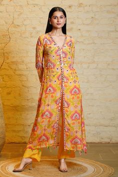 Yellow silk crepe floral printed kurta with hand embroidery, mirrorwork, shells and tassels detailing on hem. Paired with straight pant. - Aza Fashions Mirrorwork Kurta Women, Printed Kurti Designs, Indian Closet, Tie Dye Fashion, Printed Kurti, Pant Set For Women, Yellow Silk, Manish, Suit Designs