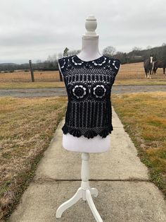 "Black Lacy Crochet Tank Top.  Great with a camisole underneath or as a bathing suit coverup.  Looks great with jean, shorts, or a skirt.   Bust 34\", length 19 in.  Approximate size M  Custom order - message me with color Custom Orders usually take about 2-3 weeks to create (not including shipping time). However, depending on the number of orders I have, it could take more or less time to make the item and ship it to you. If you need it by a certain day, feel free to message me and I can let you know if that will be possible!Dress form used is a size medium." Hippie Stretch Tops For Beach, Hippie Stretch Tops For The Beach, Hippie Style Stretch Tops For Beach, Bohemian Lace Crop Top For Beach, Bohemian Lace Crop Top, Festival Beachwear Crochet Lace Top, Sleeveless Crochet Beachwear Tops, Beachwear Tops With Crochet Trim For Festivals, Beachwear Lace Crochet Top For Festival